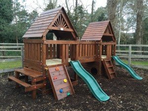 Creche and playschool double tower climbing frame with slides picnic table and bench