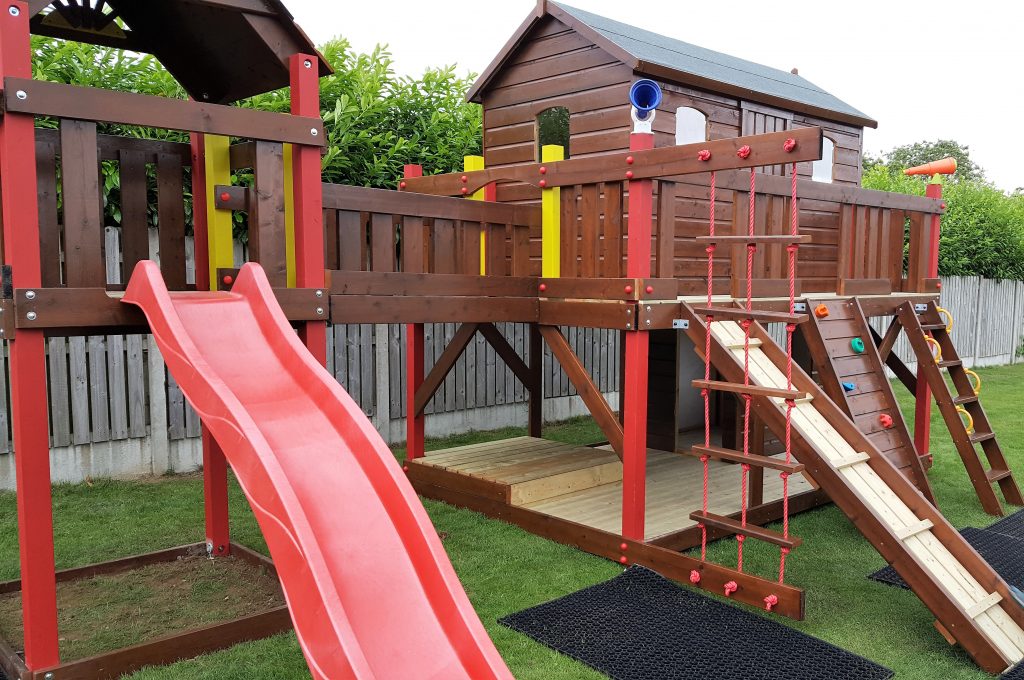 Large tree house with lower shop area ,bridge link climbing frame ,slide