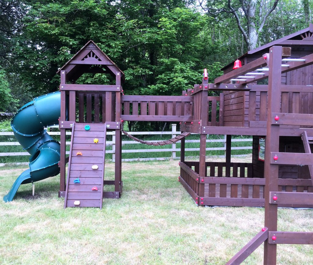 Large tree house,spiral tube slide,monkey bar beam,swing set,